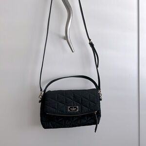 Kate Spade 8x12 bag. Snap closure. One zippered and two open pockets inside.